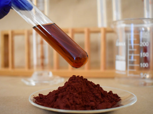 liquid and powder brown food dye in glassware