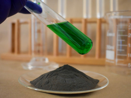 liquid and powder green food dye in glassware