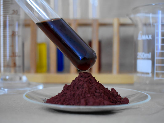 liquid and powder tamarind food dye in glassware